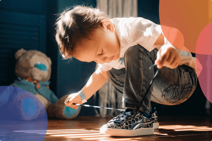 boy tying shoelace